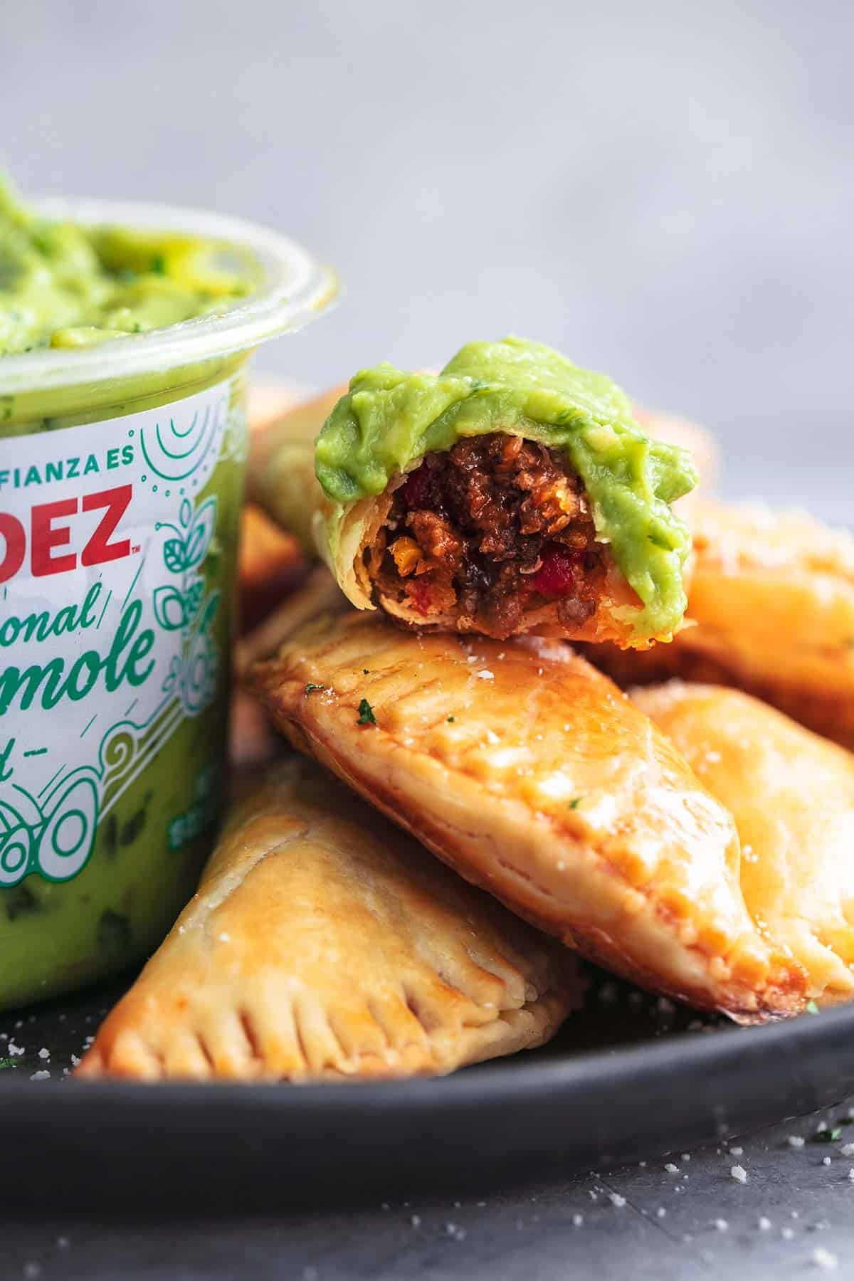 Golden brown beef empanadas on a plate